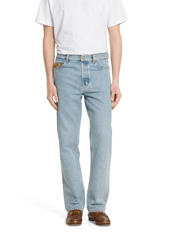 Pantalone in denim délavé con inserto GG