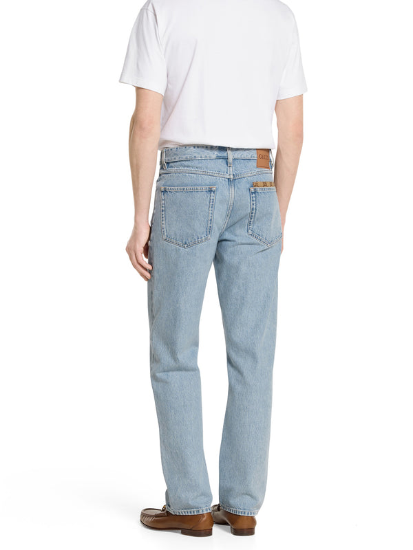 Pantalone in denim délavé con inserto GG