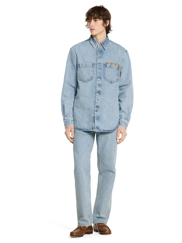 Pantalone in denim délavé con inserto GG