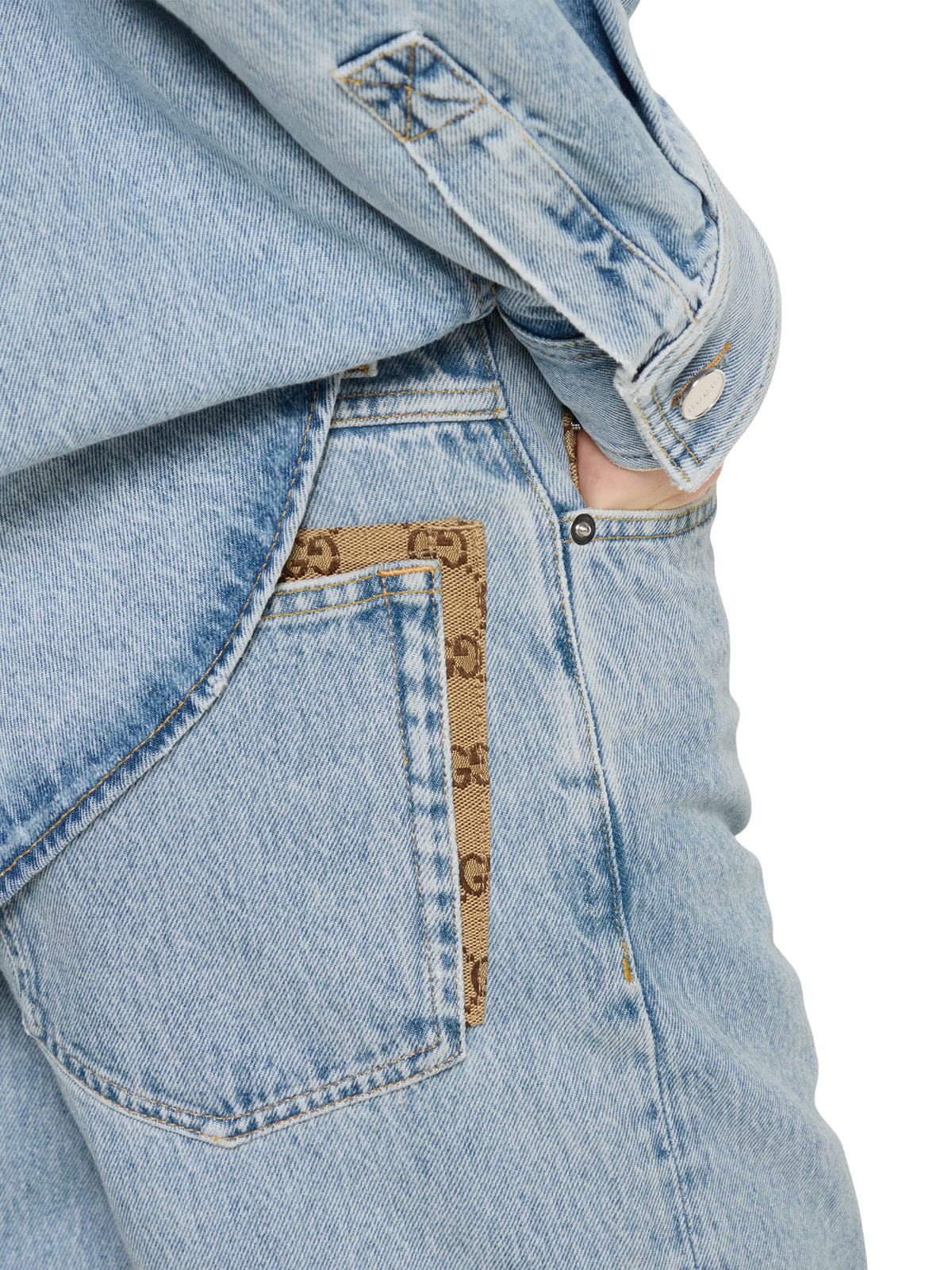 Pantalone in denim délavé con inserto GG