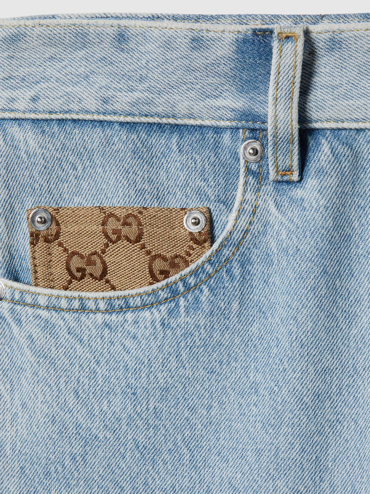 Pantalone in denim délavé con inserto GG