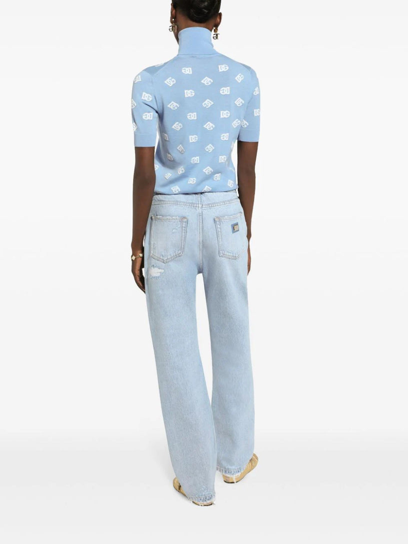 Distressed finish straight-legged jeans