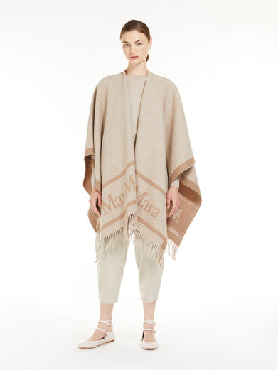Hilde wool poncho with jacquard logo