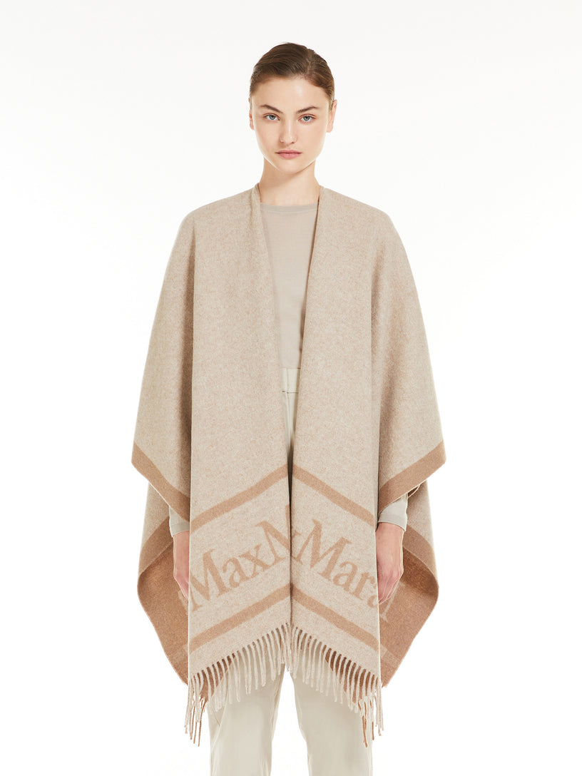 Hilde wool poncho with jacquard logo