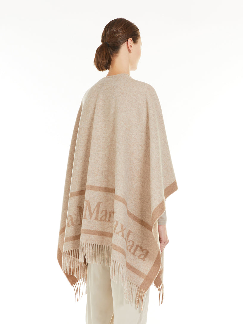 Hilde wool poncho with jacquard logo
