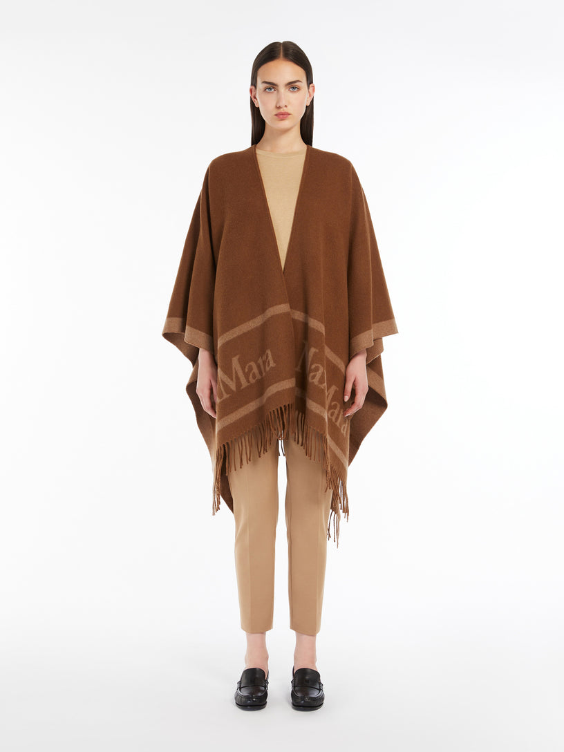 Hilde wool poncho with jacquard logo