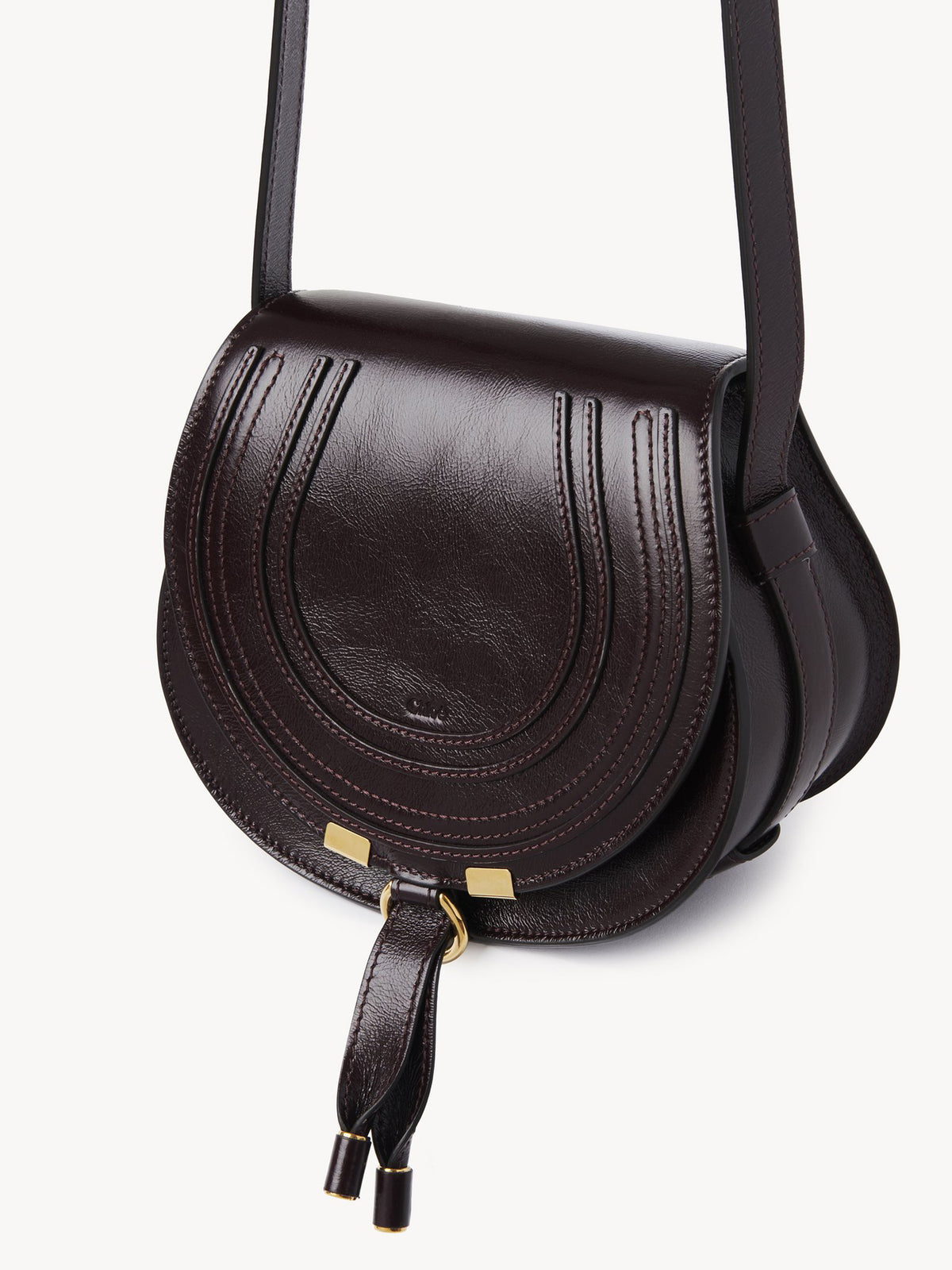 Marcie small saddle bag in shiny leather
