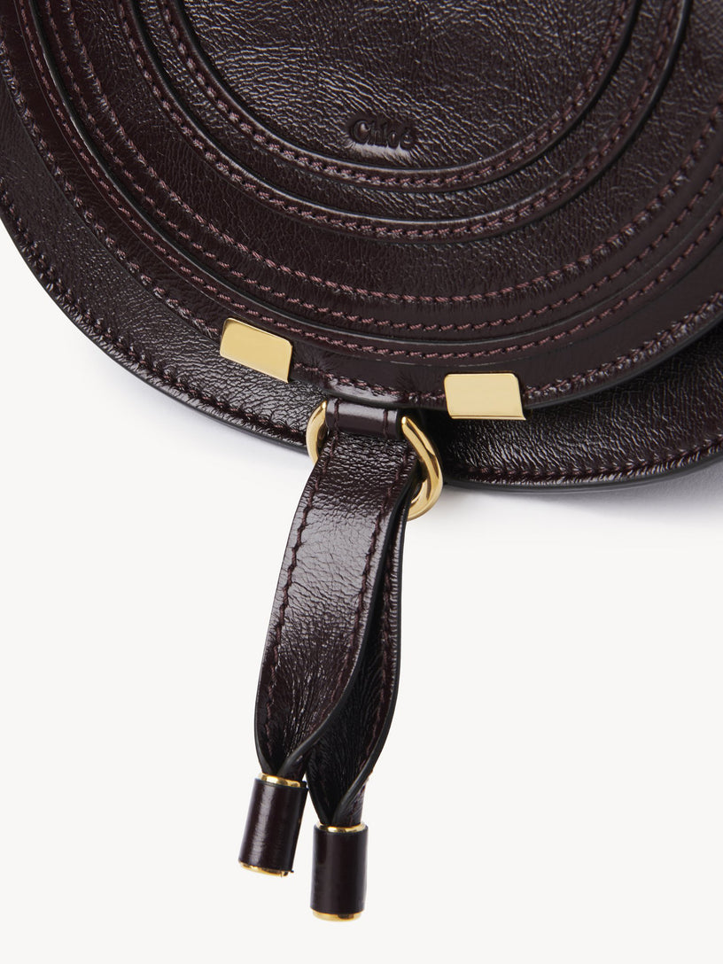 Marcie small saddle bag in shiny leather