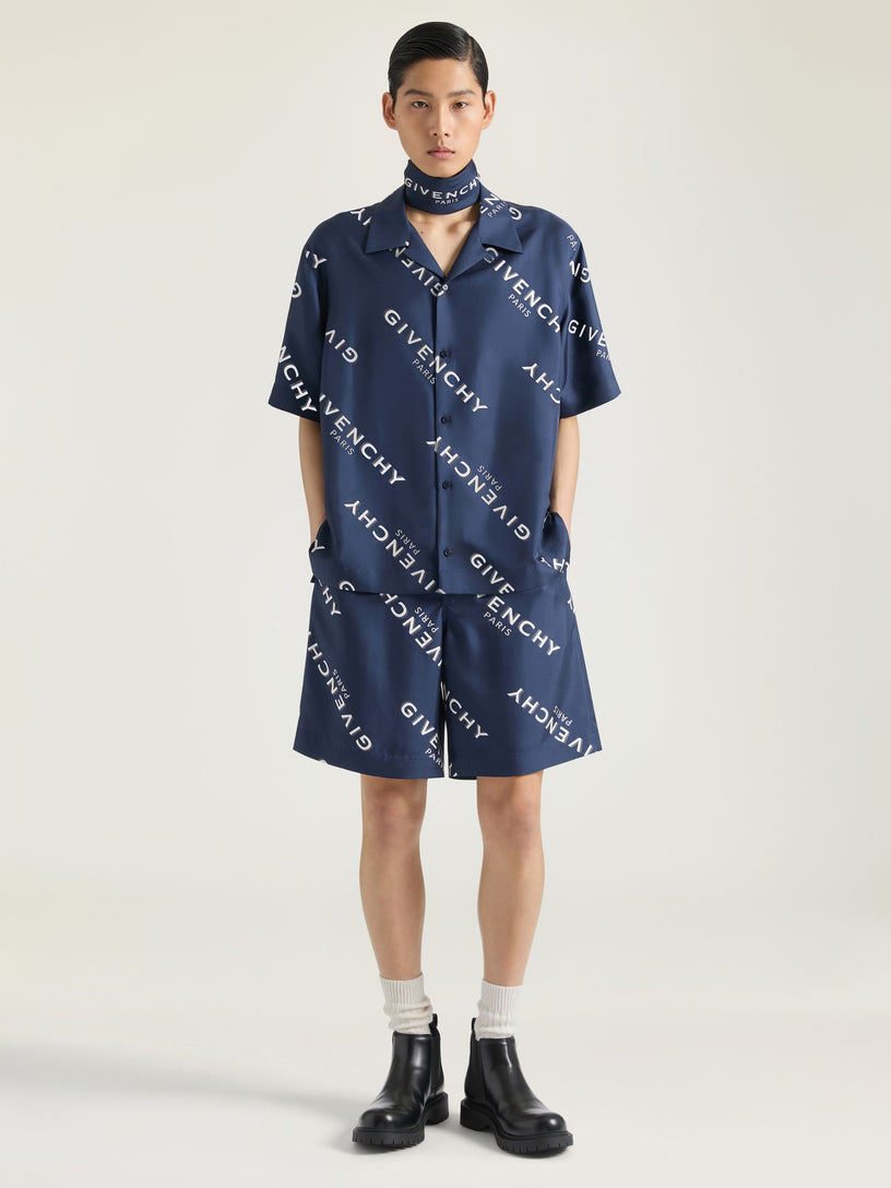 Bermuda shorts with all-over logo