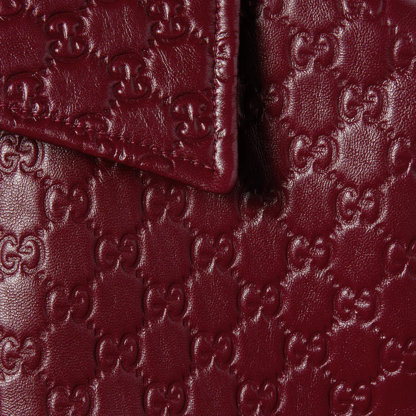 Oversized leather jacket with embossed GG