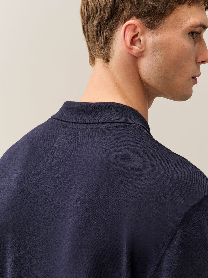 Polo in lana merino extrafine con lenti