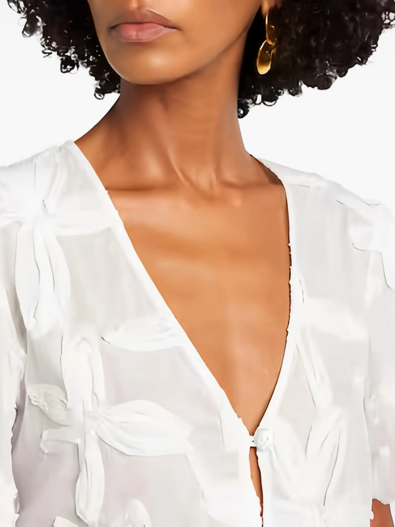 Blusa con dettagli ricamati