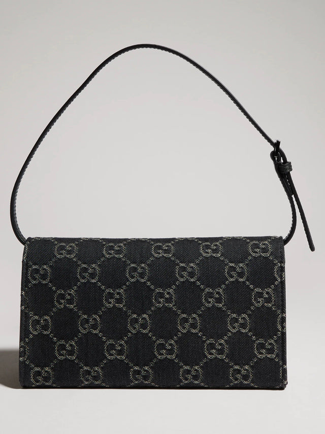 Pouch piccola con cinturino e placca Gucci