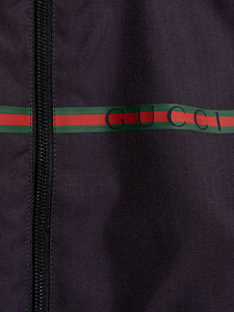 Giacca con cerniera e nastro Web