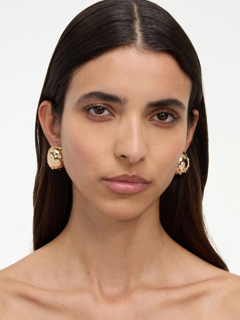 Orecchini curvi in oro con cristalli