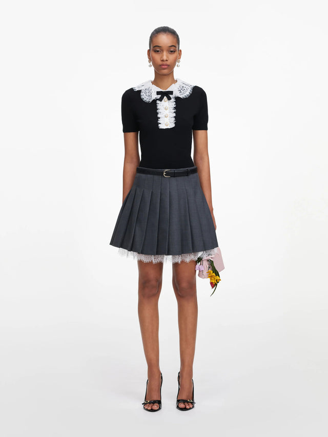 Top in maglia con colletto in pizzo