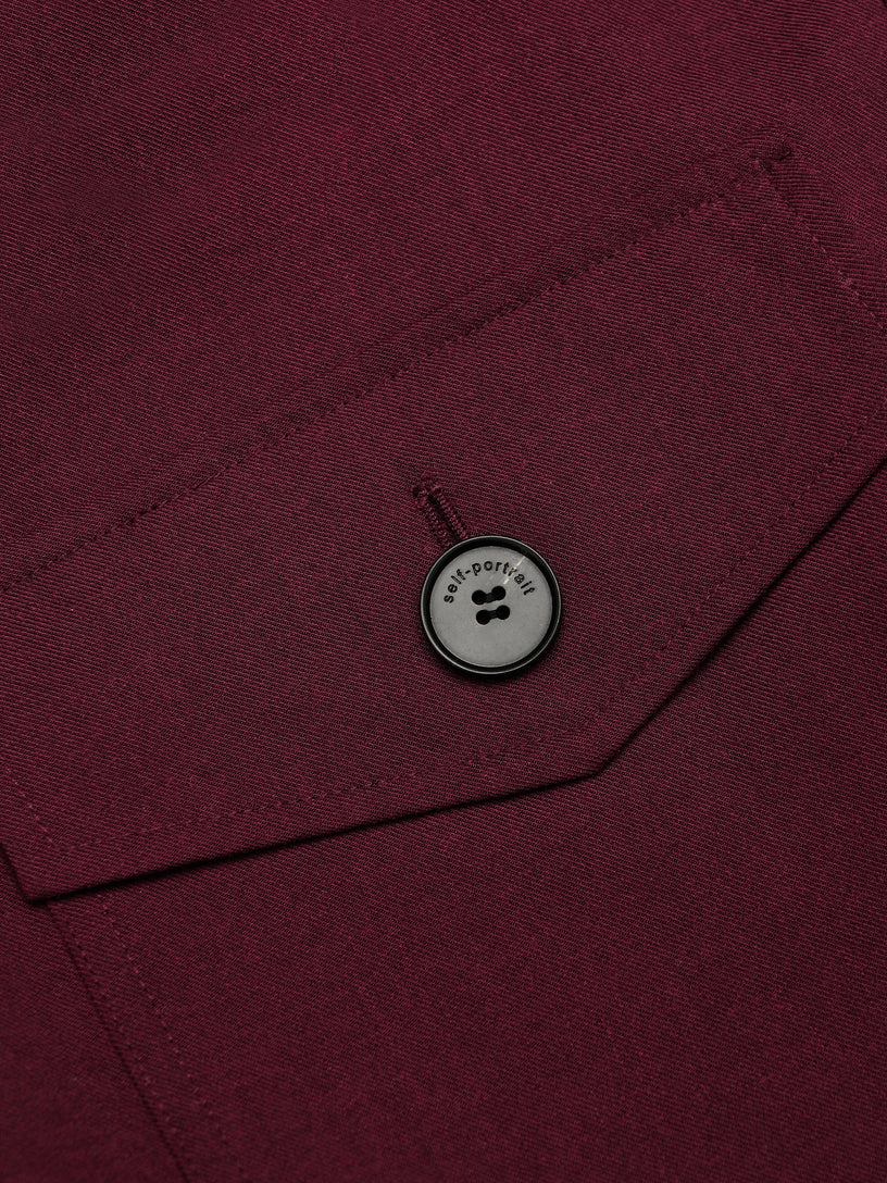 Tutina corta in twill con fiocco al collo