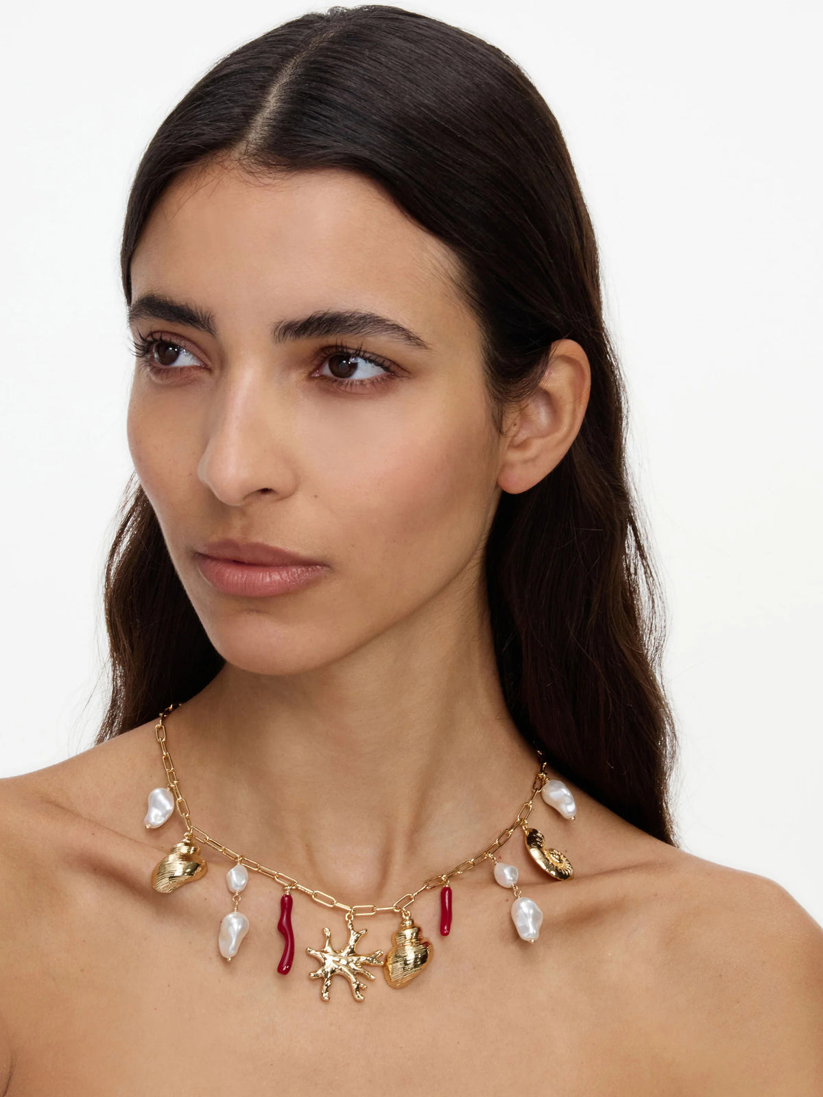 Collana con ciondolo in perla di corallo dorato