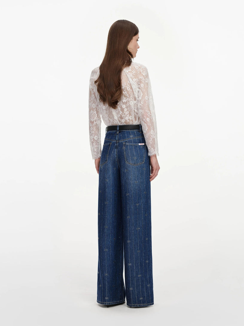 Jeans in denim con strisce di strass