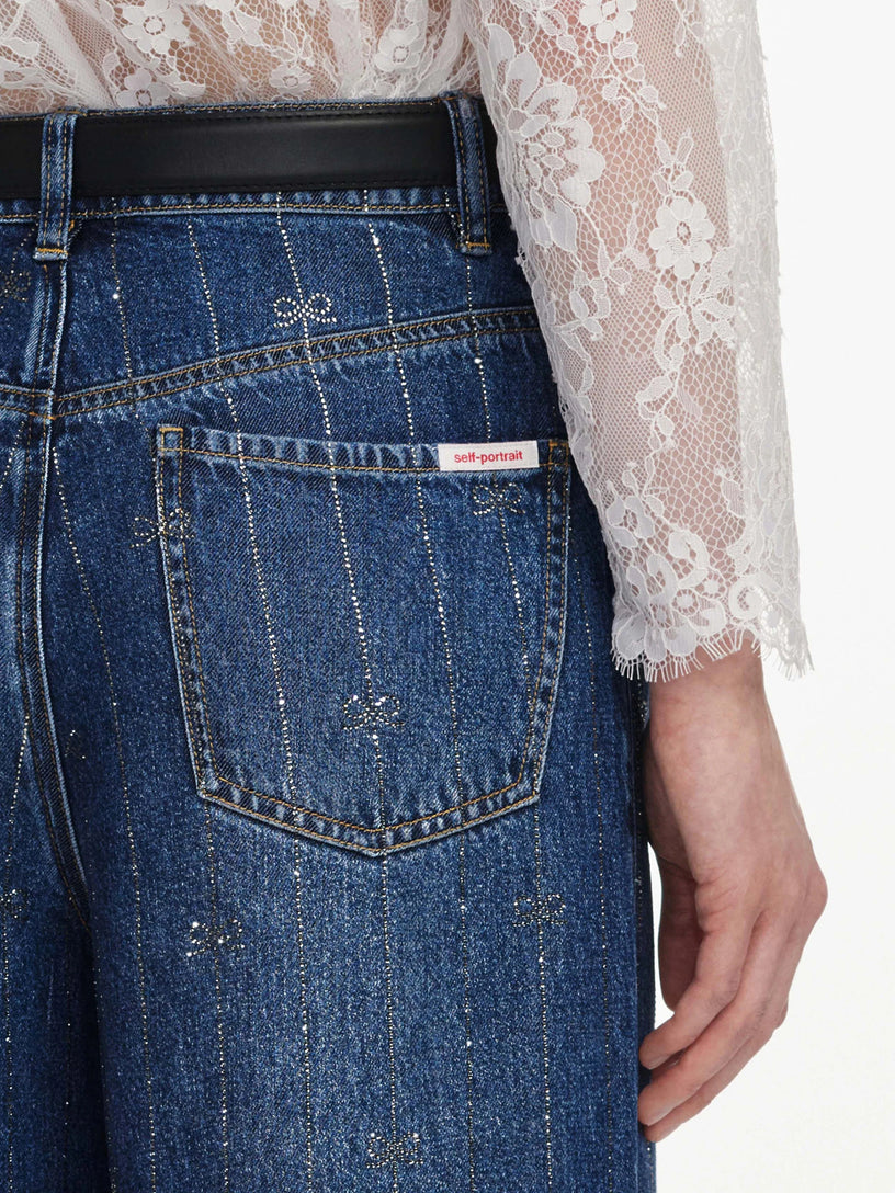 Jeans in denim con strisce di strass