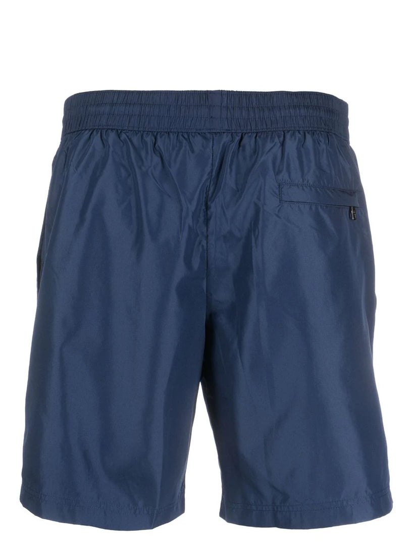 Mid-length swim trunks with branded plate