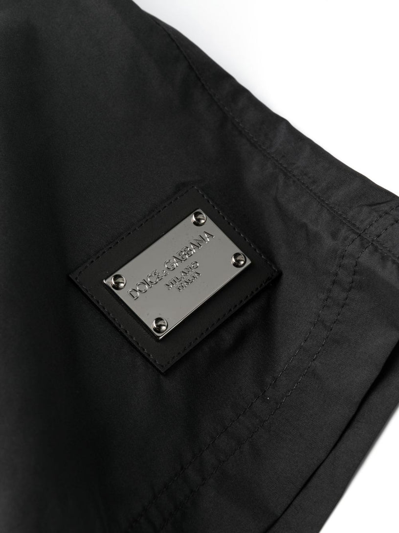 Mid-length swim trunks with branded plate