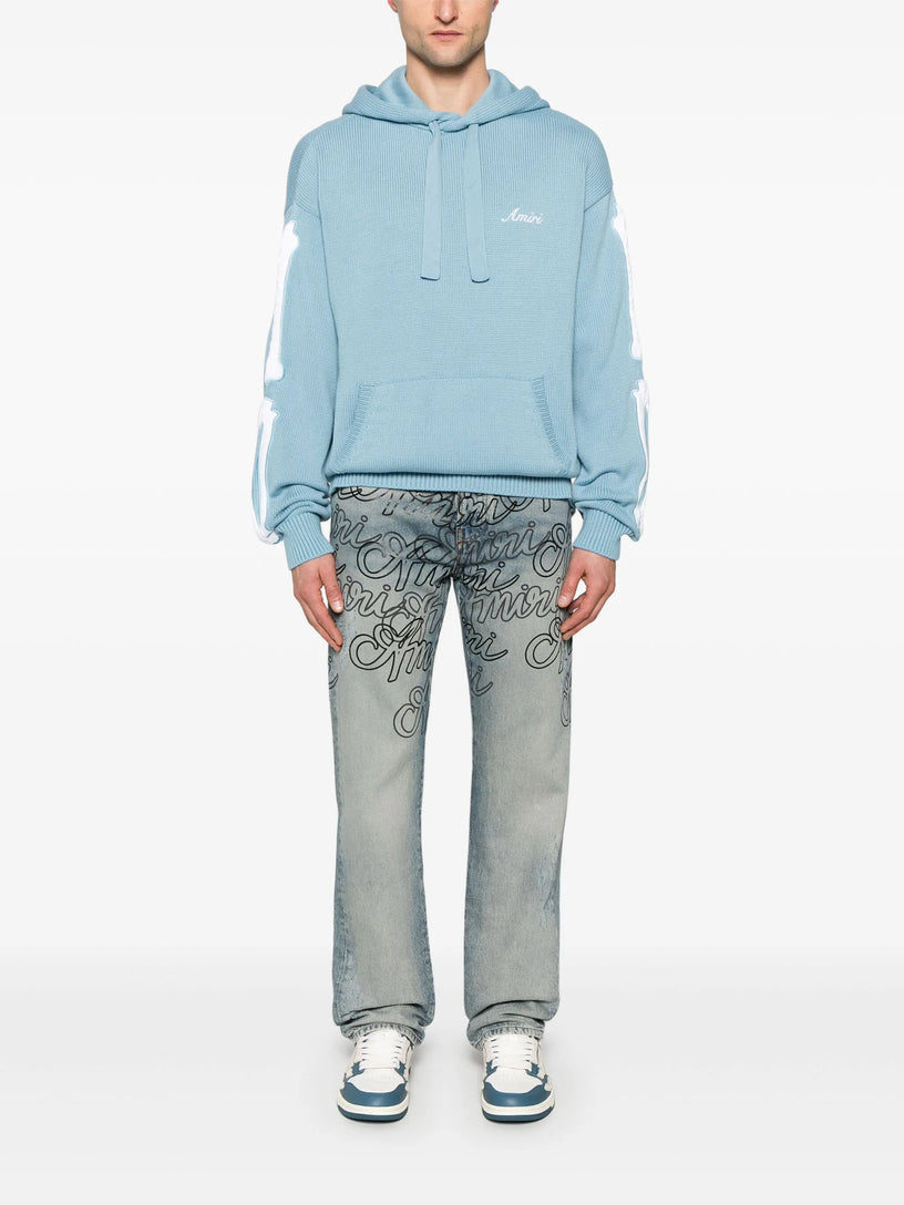Jeans overlay Amiri script