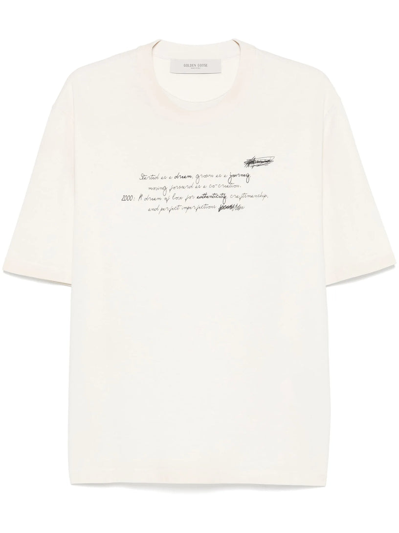 Unisex t-shirt in worn white with printed writing