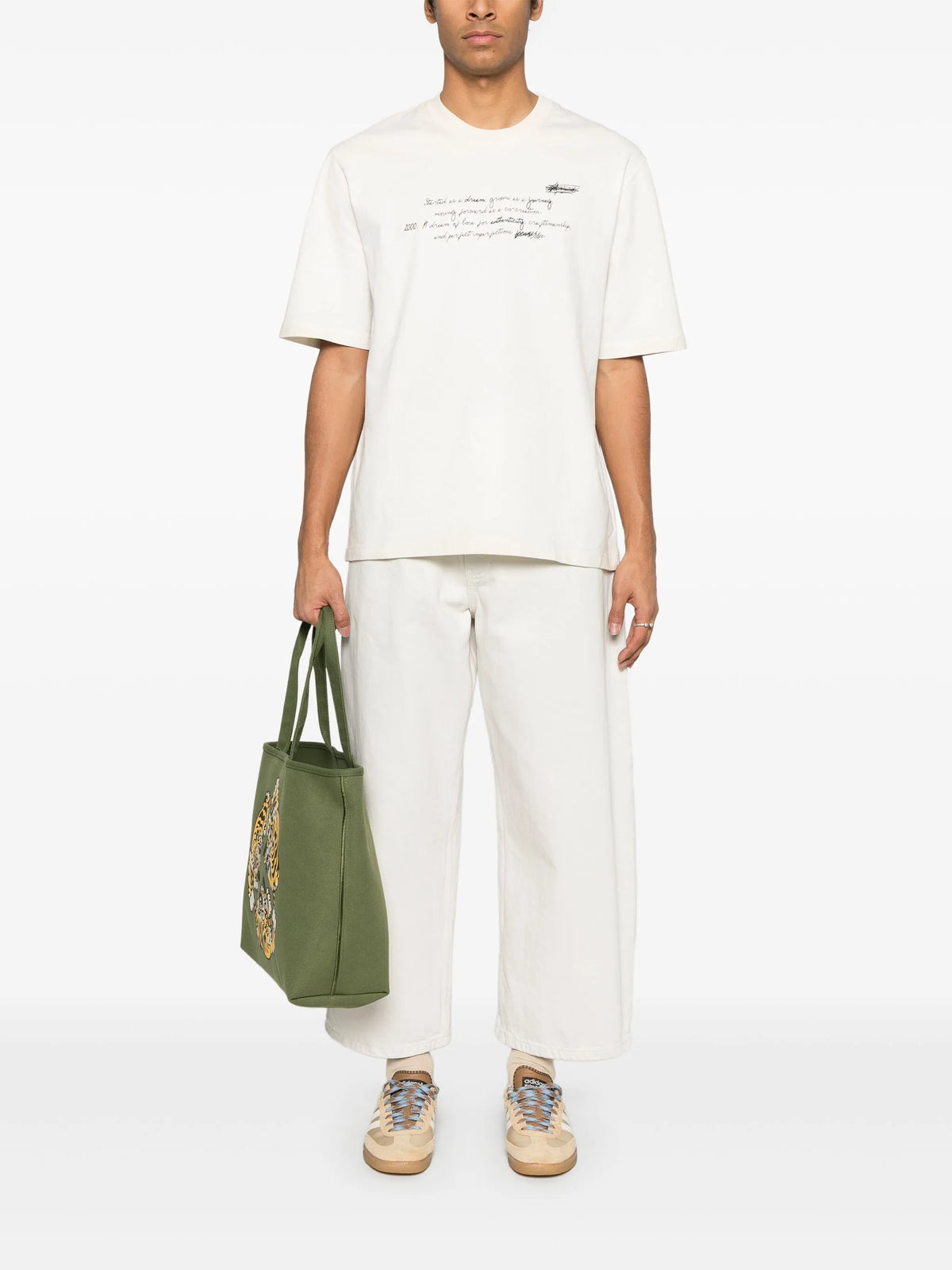 Unisex t-shirt in worn white with printed writing