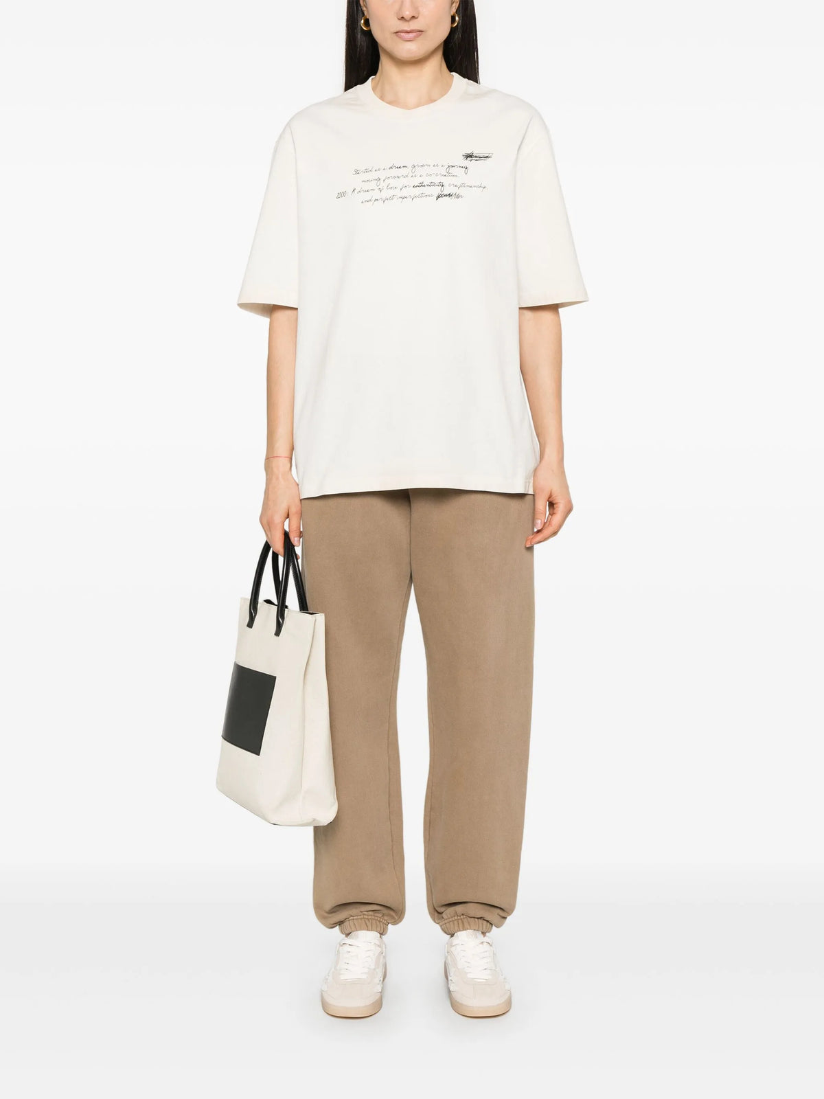 Unisex t-shirt in worn white with printed writing