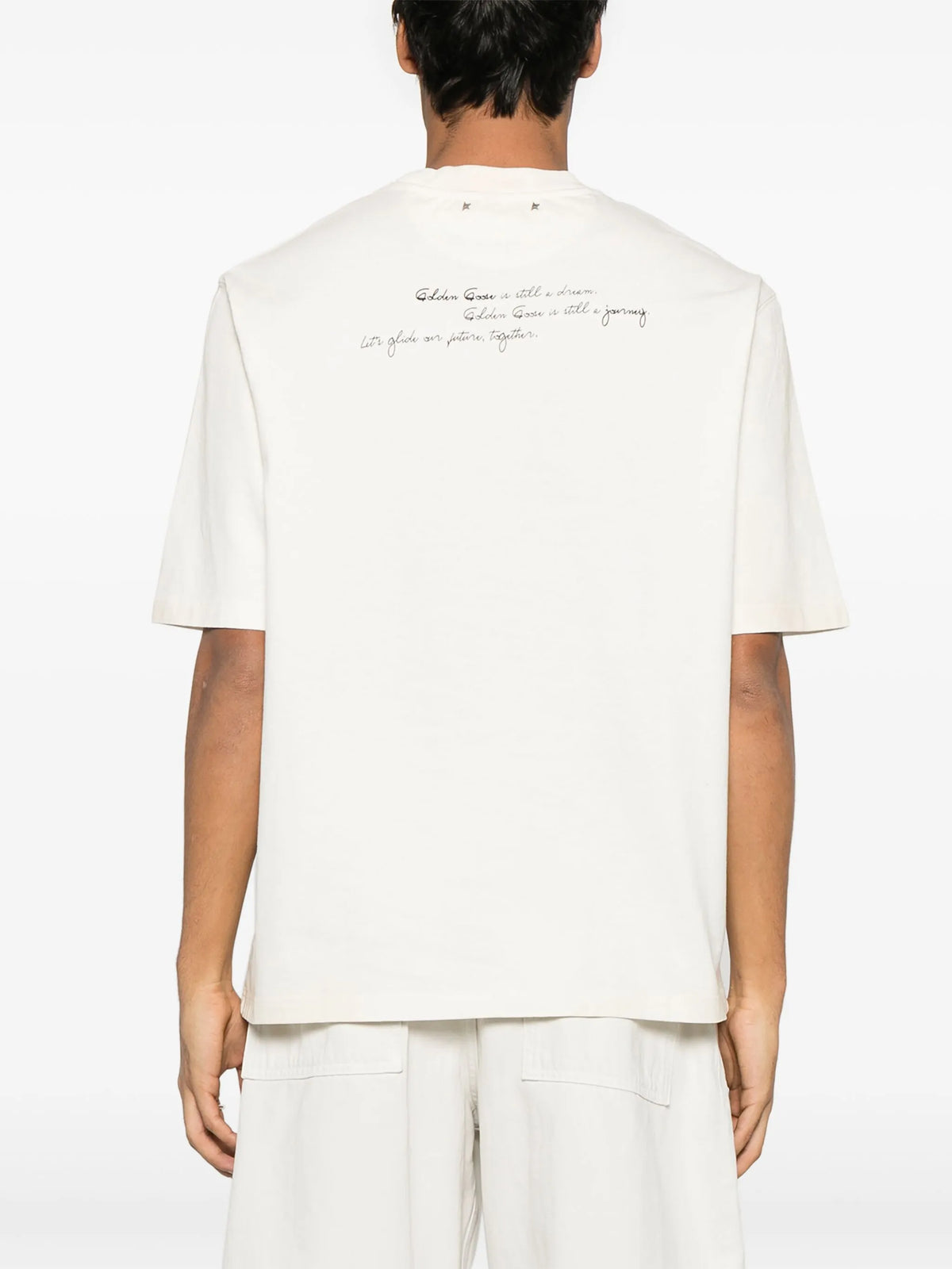 Unisex t-shirt in worn white with printed writing