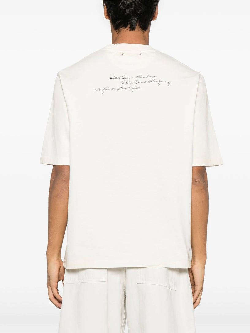 Unisex t-shirt in worn white with printed writing