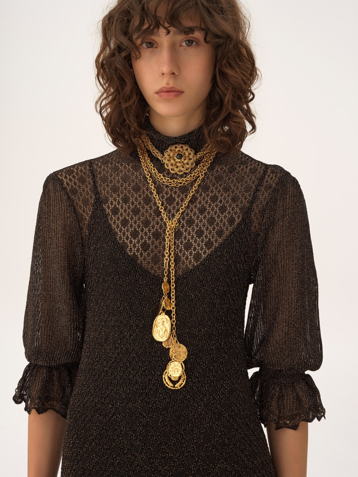 Mini dress with puffed sleeves and ruffles in lurex knit