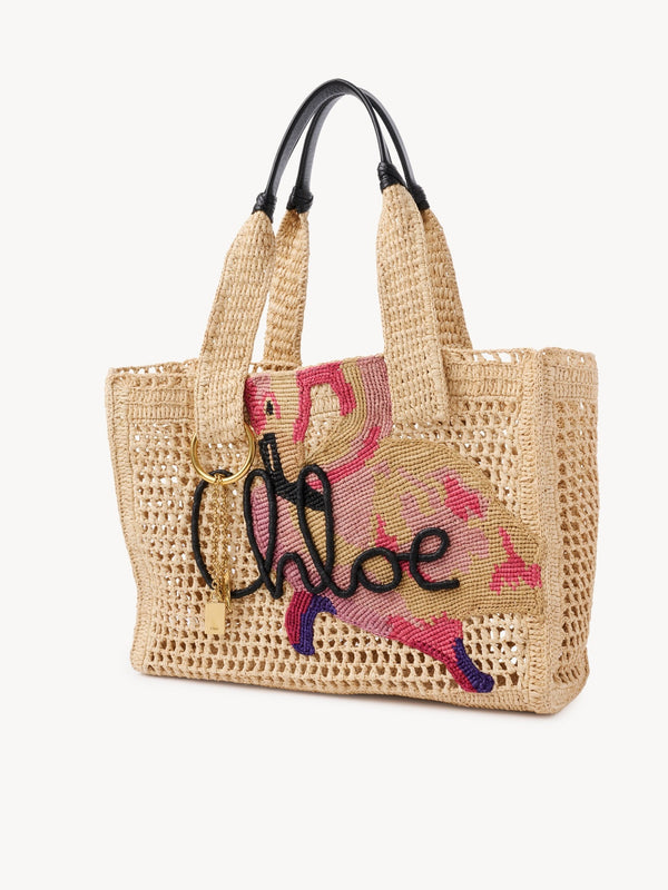 East-West Summer Banana tote bag in raffia