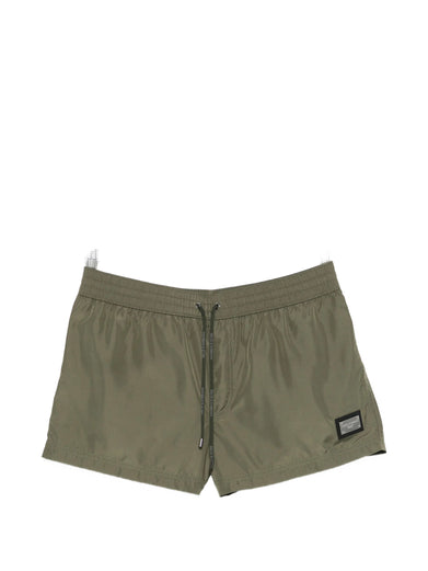 Short swim trunks with branded tag
