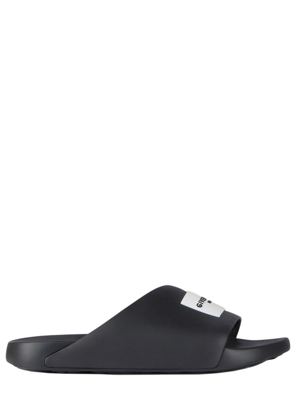 Label Slide mules in rubber