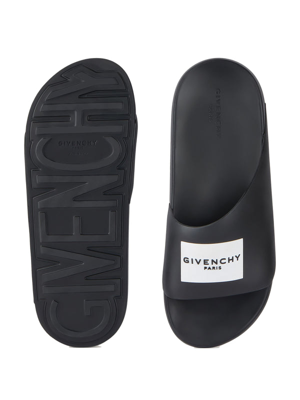 Label Slide mules in rubber