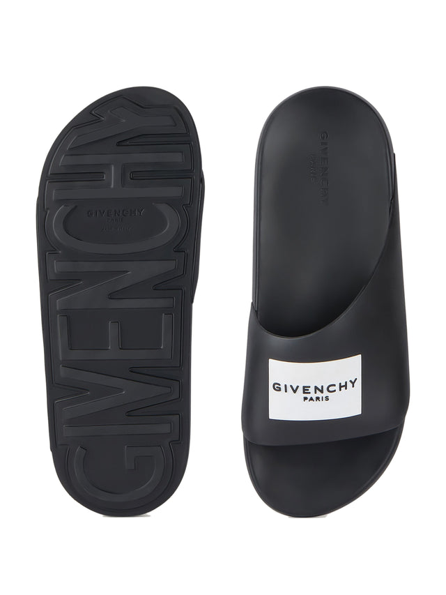 Label Slide mules in rubber