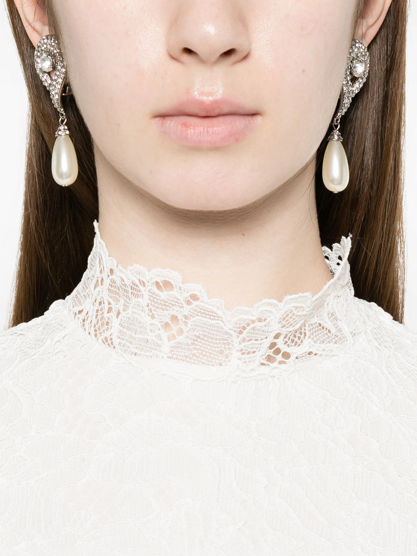 Crew-neck lace dress 
•Open back 
•Zip and button closure at the back 
•Back slit 
•Lined 
•100% polyester 
•Made in China