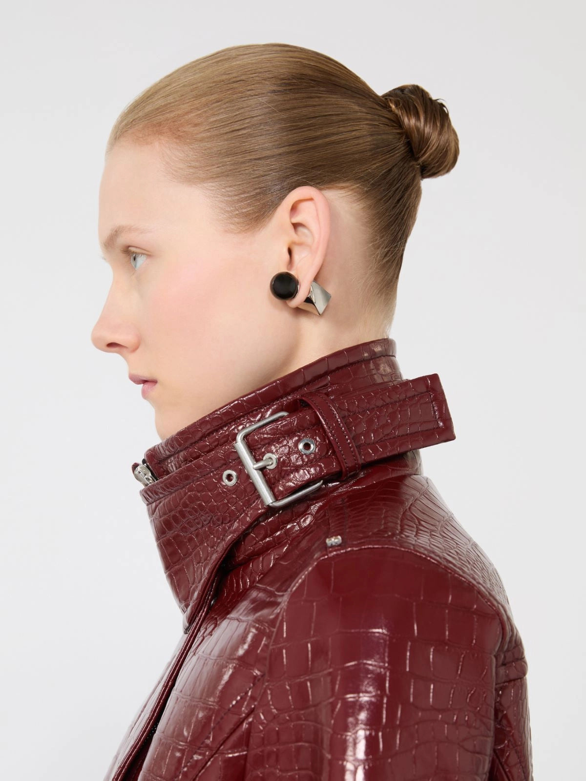 Patent leather cropped jacket with alligator print